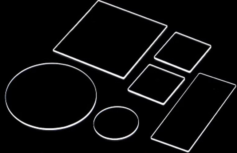 An image showing a high purity fused quartz wafer or substrate, with a purity level of over 99.99% and a transmittance of over 90% at 210nm to 300nm.